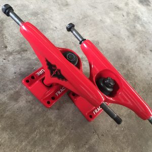 Red fracture skateboard trucks