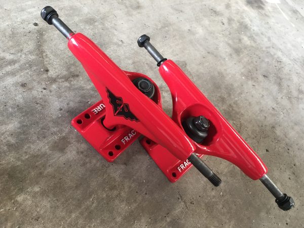 Red fracture skateboard trucks