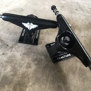 Black fracture skateboard trucks
