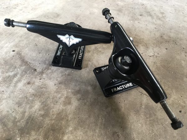 Black fracture skateboard trucks
